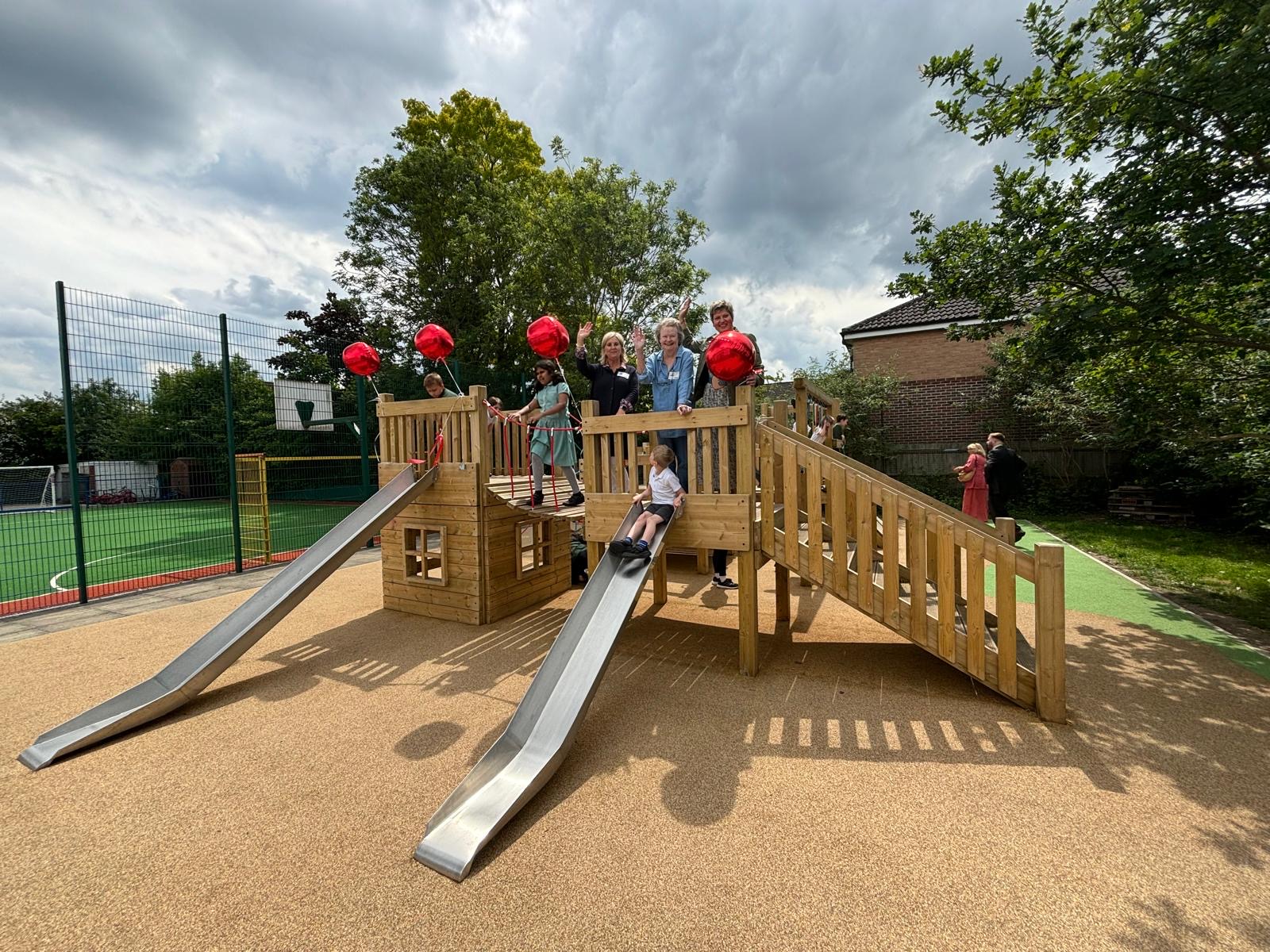 TVF visit Clarendon Primary Center to see the impact of the new playground structure 